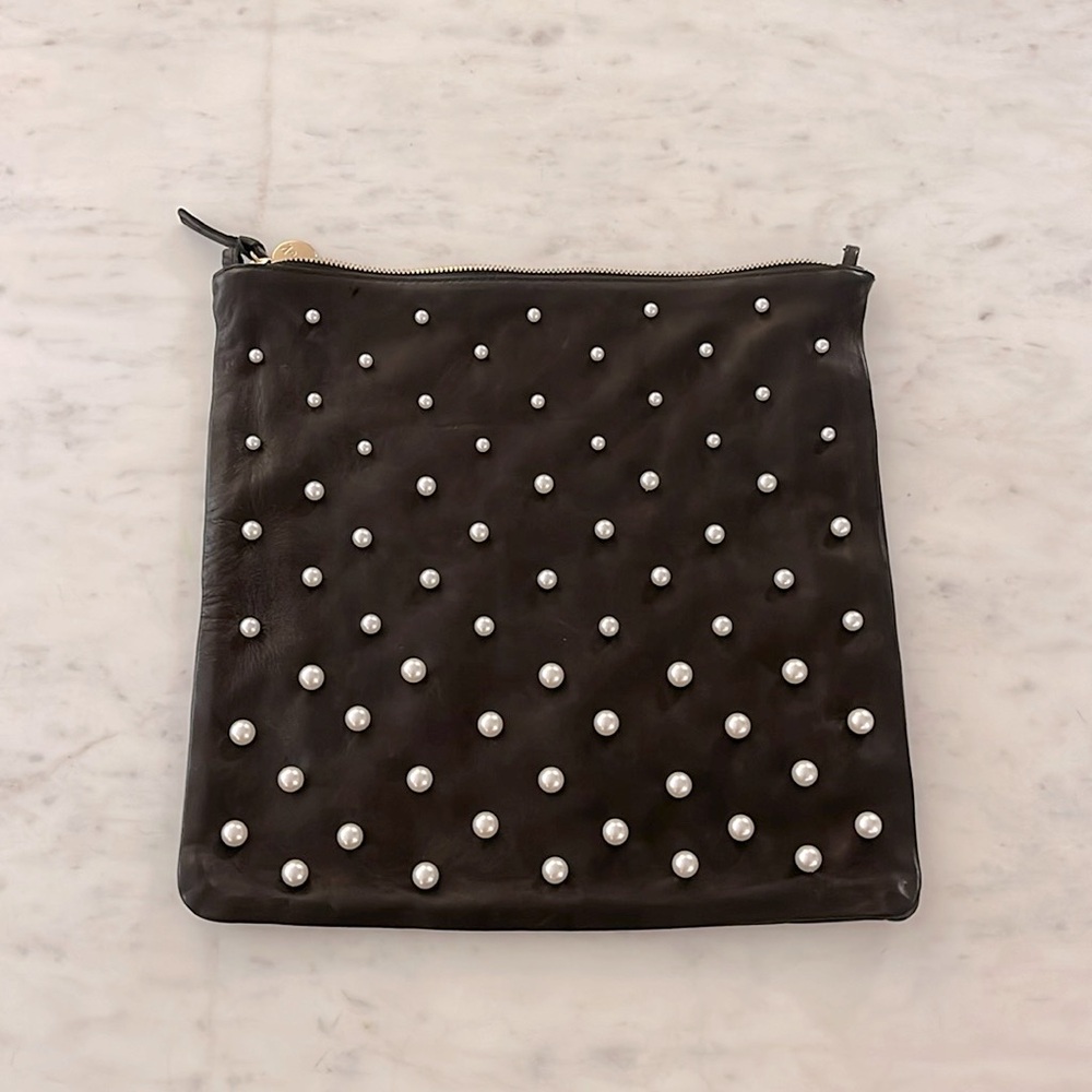 Clare V foldover leather clutch with tabs. Soft black leather with pearl details